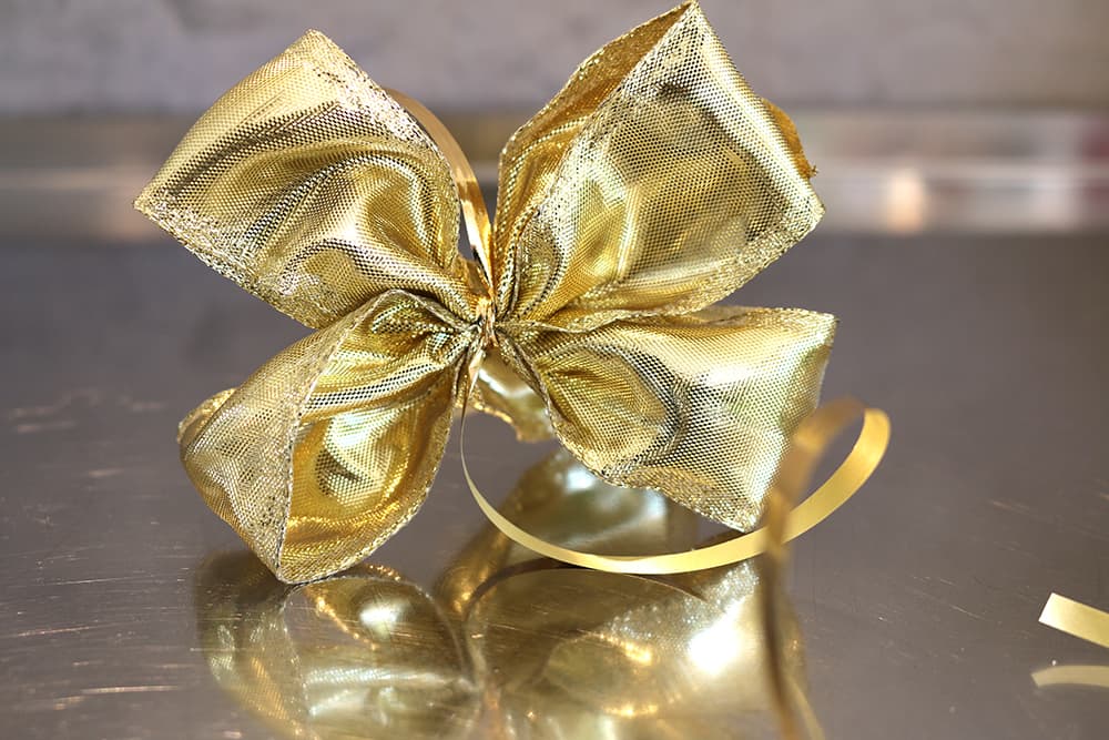 geschenkverpackung-schleife-gold-s Geschenkschleife, gold